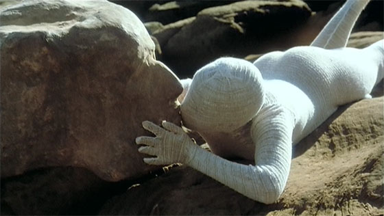 The film's opening dream sequence, with Alma Mahler (Georgina Hale), in chrysalis, kissing a stone in the profile of Gustav Mahler.