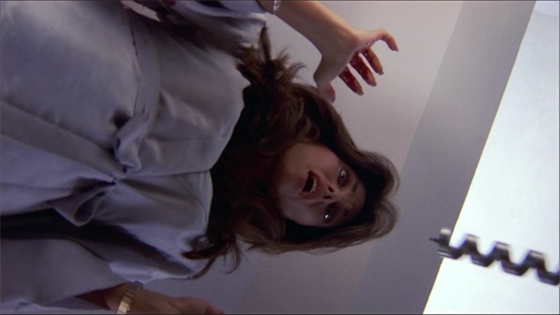 Gloria Revelle (Deborah Shelton) encounters a driller killer.
