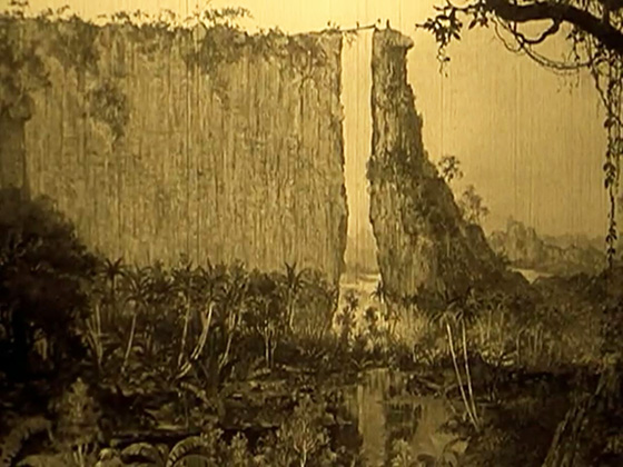 The plateau of the Lost World, as the explorers cross to it from a felled tree.