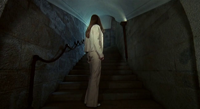 Christina (Christina von Blanc) innocently explores a haunted mansion. 