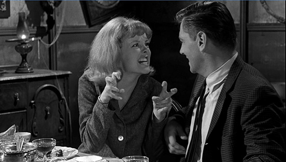 Ann Morris (Mary Mitchel) and Peter Howe (Quinn Redeker) discuss monsters over dinner.