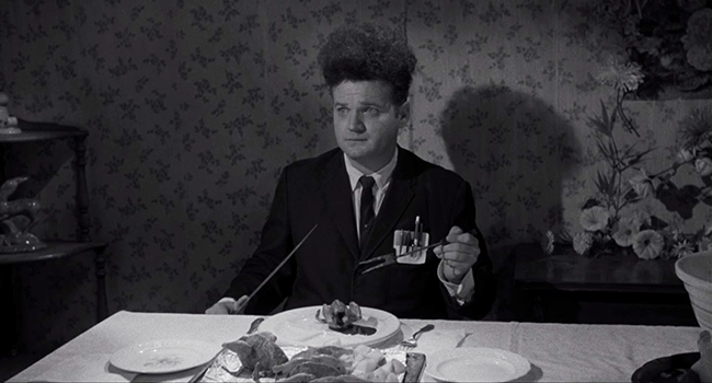 Henry Spencer (Jack Nance) endures a traumatic dinner with his girlfriend's family.