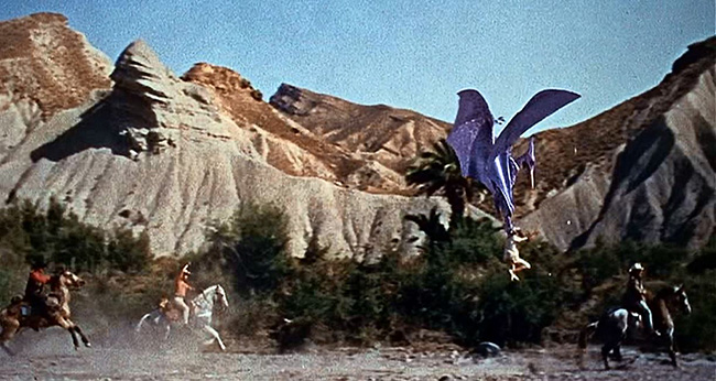 A Pteranodon hoists a cowboy off his horse in "The Valley of Gwangi."