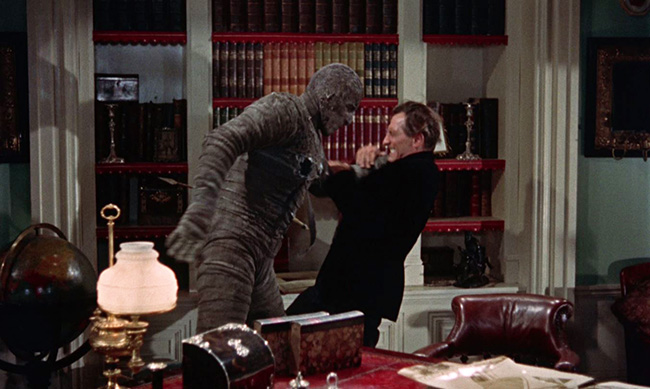 The mummy attacks John Banning.