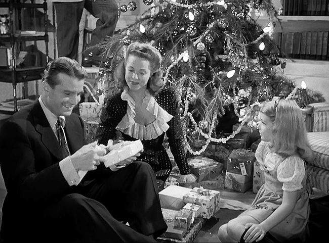 The Reed Family Christmas: Oliver (Kent Smith), Alice (Jane Randolph), and Amy.