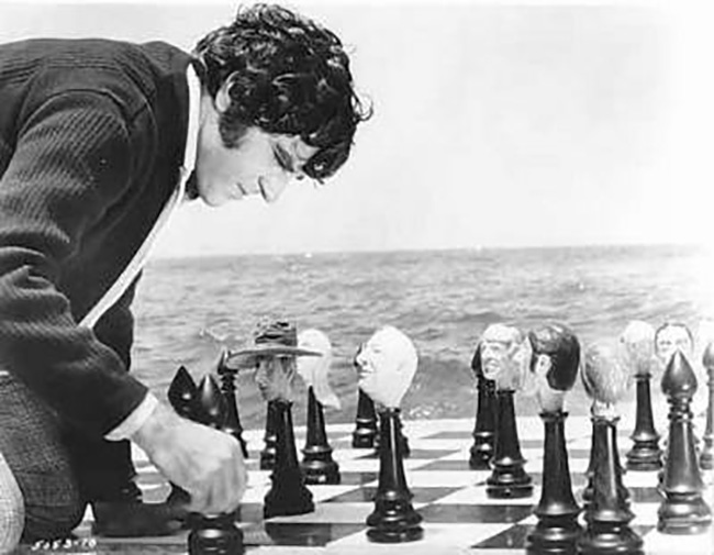 Heironymus Merkin plays chess with the figures from his past.