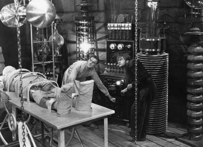 Publicity still of Henry Frankenstein (Colin Clive) and his assistant Fritz (Dwight Frye) at work on the monster.