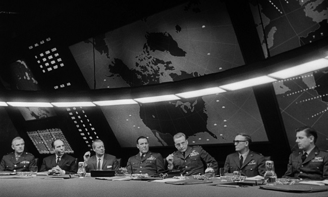 General Buck Turgidson (George C. Scott) lectures in the War Room.