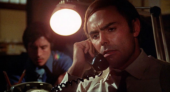 John Saxon as Lieutenant Ken Fuller.